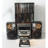 A Phillips music system together with two boxes of CD's