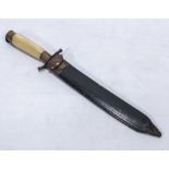 A horn handled hunting knife dated 1925, with wood and copper scabbard, possibly Bowie knife