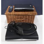 A picnic basket, sky box and one other