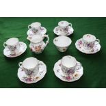 A part china coffee set with associated sugar bowl