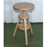 A pine adjustable stool