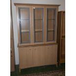 A display cabinet on cupboards