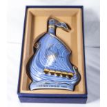 A vintage ceramic Larson Cognac decanter