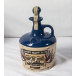 A vintage Lamb's Navy Rum ceramic decanter HMS Warrior