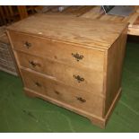 A pine chest of three drawers