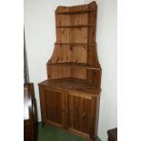 A pine corner cupboard