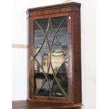 A Georgian mahogany corner cabinet.