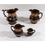 Four lustre ware jugs