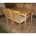 A pine kitchen table and four chairs