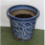 A blue pottery plant pot