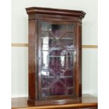 A Georgian mahogany corner cabinet.