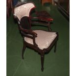 An Edwardian mahogany arm chair.