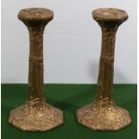 A pair of gilded metal Japanese candlesticks decorated with chrysanthemum and dragons