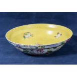 A Chinese bowl decorated to the outside with flowers and Chinese poetry, marks to base