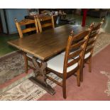 An oak refectory table and 4 chairs