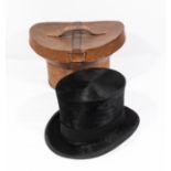 A top hat in a fitted leather case