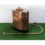 A vintage copper crop sprayer