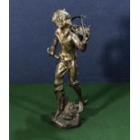 A cast brass figure of a boy