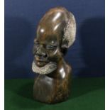A polished stone carving of an African gentleman, circa 1990 Swaziland