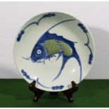 A Chinese pottery bowl with fish design