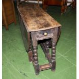 An oak gateleg table.