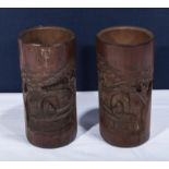 A pair of Chinese bamboo spill vases carved with figures and trees 8.5 inches tall