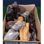 A box containing African wooden carvings and other items