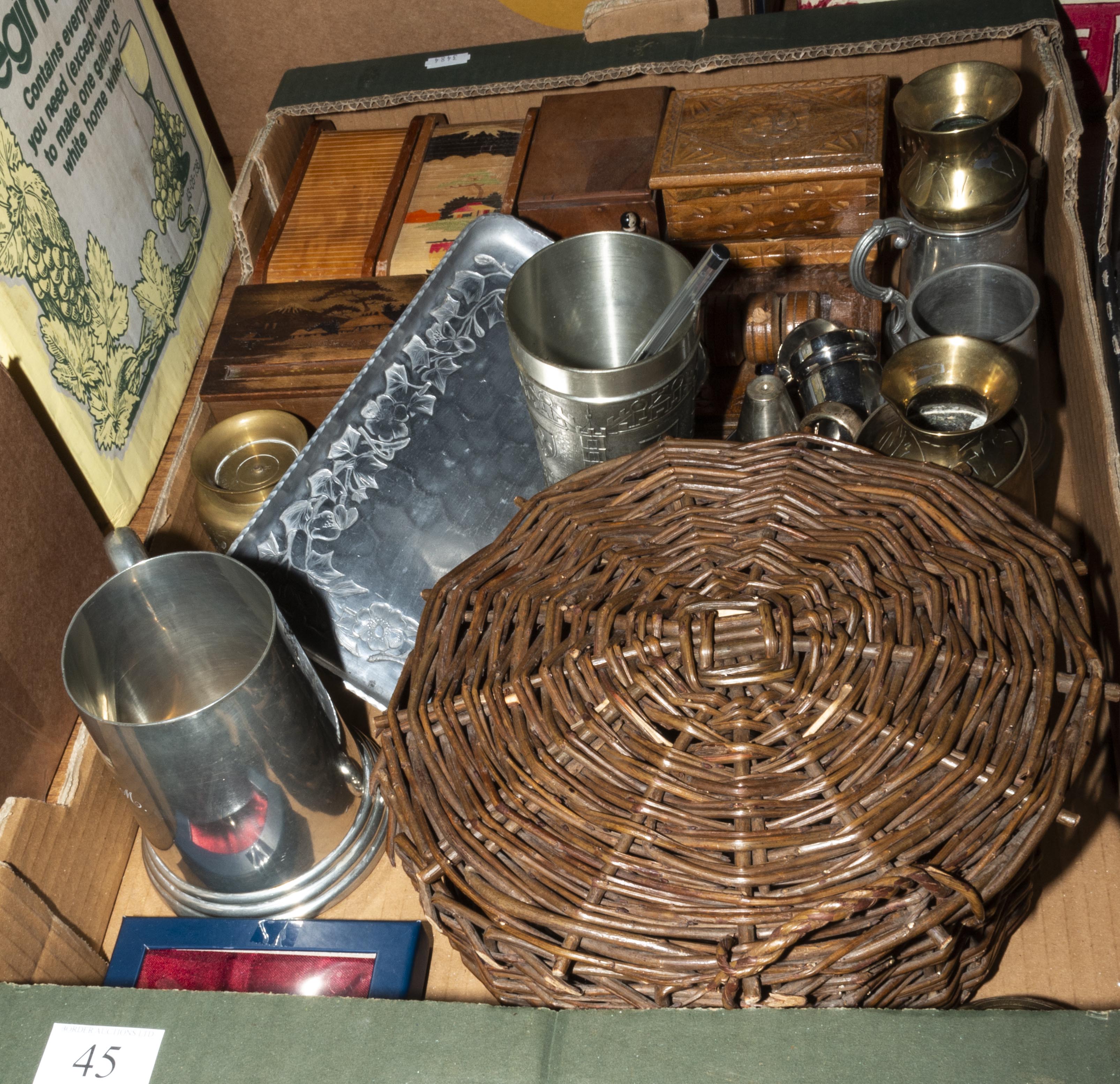 A box containing metal ware and wooden items