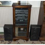 A Sony music centre with CD's, records and two speakers in mahogany cabinet