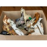 A box containing pottery animals