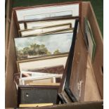 A box of framed prints