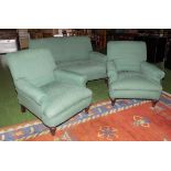 A two seater sofa and two matching armchairs