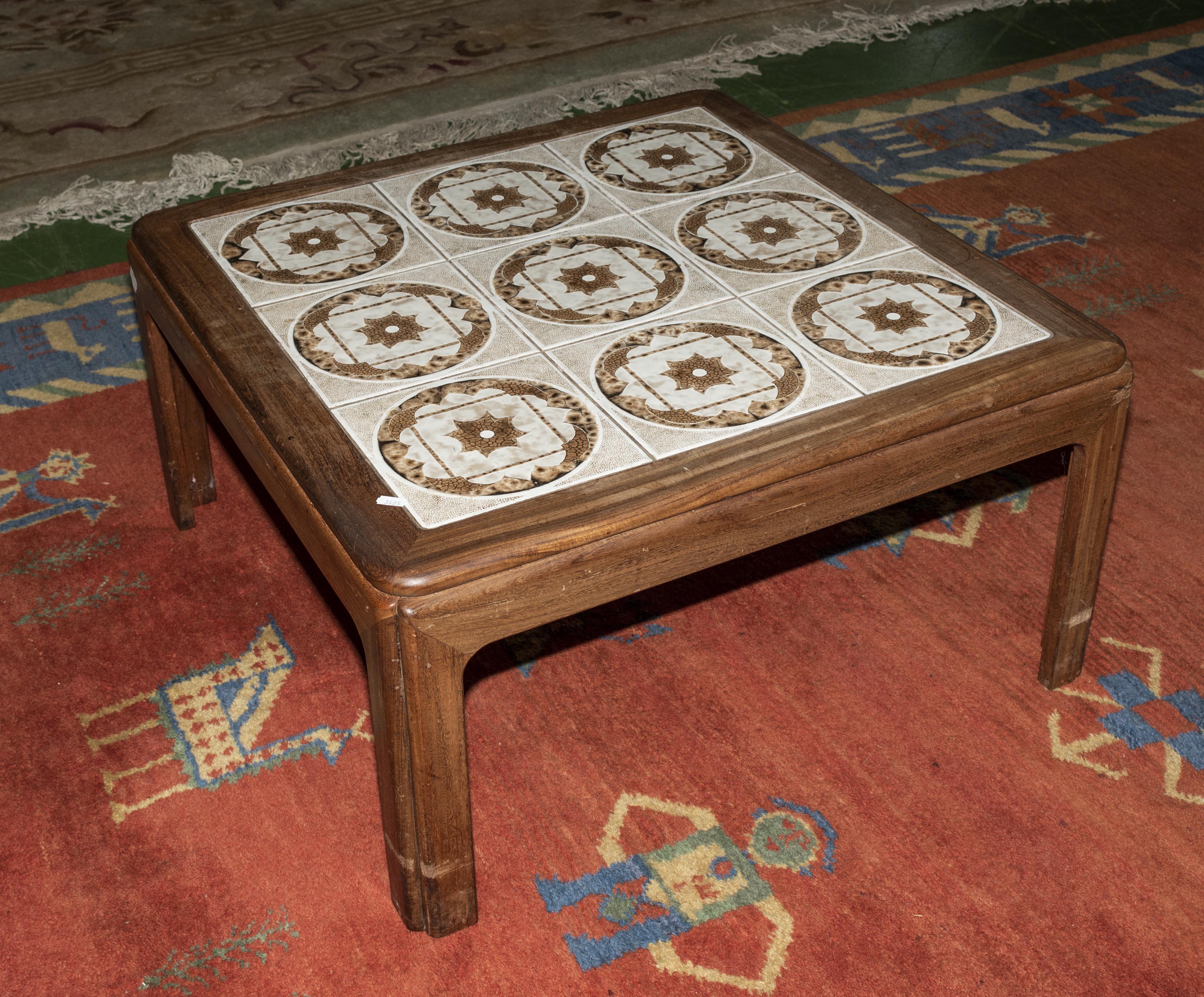 A tiled top teak coffee table
