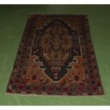 An Old Baluchi rug 146cm x 87cm