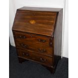 A mahogany inlaid bureau