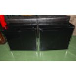 Two black glass cabinets