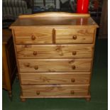 A pine chest of two over four drawers