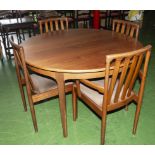 A Nathan teak dining table and four Meredew dining chairs