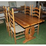 A pine table and four chairs