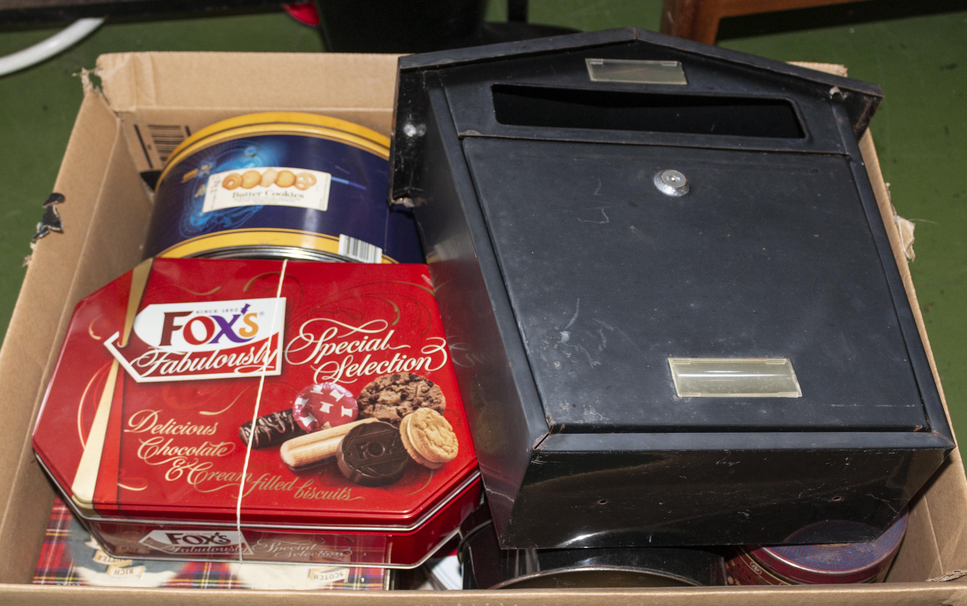 A box containing vintage tins and a letter box