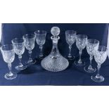 A ship's decanter and eight wine glasses