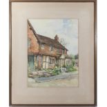 A framed watercolour depicting a country cottage, signed A Mars