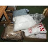 Three boxes of upholstery fabrics and stuffing