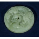 A Q'ing dynasty celadon jade carved pendant