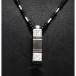 A Tuareg ebony and silver necklace from Mali