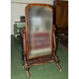 A Victorian mahogany cheval mirror.