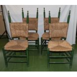 A set of four rush seated chairs.