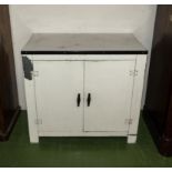 A metal kitchen storage cabinet made by Fisher, bakelite handles and fitted interior .