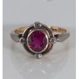 An 18ct yellow and white gold red stone and diamond ring (5gms)
