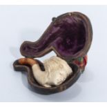 A small Meerschaum pipe of a lady, with amber tip in fitted case